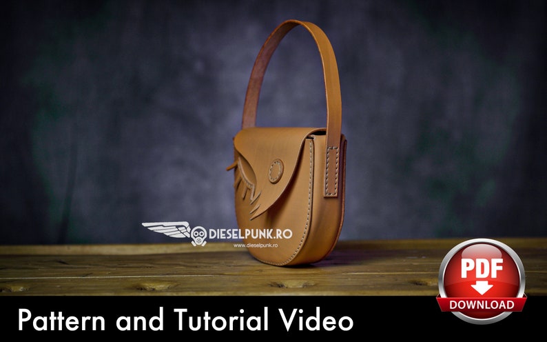May include: A brown leather handbag with a flap and a strap. The bag has a unique design with a bird-like shape. The bag is sitting on a wooden surface. The text "Pattern and Tutorial Video" is at the bottom of the image. A red button with the text "PDF DOWNLOAD" is in the lower right corner of the image.