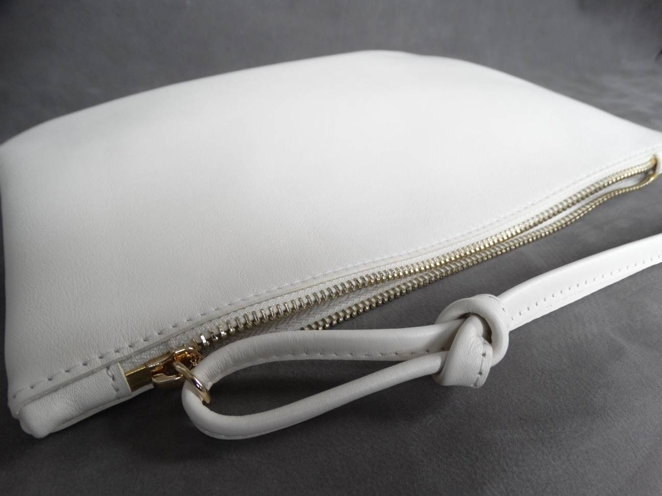 white padded clutch bag