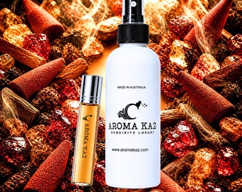 May include: A white spray bottle and a small glass roller bottle labeled Aroma Kaz. The spray bottle features the text Made in Australia, Aroma Kaz Exquisite Luxury, and the website address. Both containers are surrounded by incense cones.