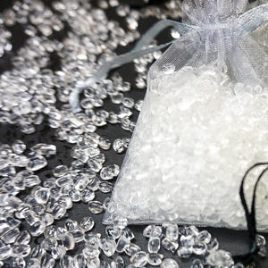 Close-up of scented aroma beads in organza sachet with loose beads, long-lasting vegan air freshener for drawers, wardrobes, cars and small spaces, handmade in Australia.