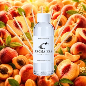 May include: A clear glass reed diffuser bottle with a white cap and a white label featuring the text MADE IN AUSTRALIA, AROMA KAZ, EXQUISITE LUXURY, and www.aromakaz.com, surrounded by several thin wooden diffuser reeds extending outwards.
