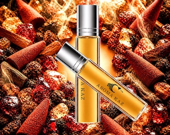 May include: Two amber-colored perfume bottles with silver caps, labeled "Aroma Kaz", rest among red incense cones, crystals, and wood pieces. The background has a warm, glowing effect, suggesting a spa or aromatherapy theme.
