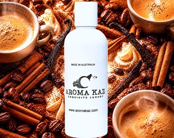 May include: A white cylindrical bottle with a cap featuring black text that reads MADE IN AUSTRALIA, AROMA KAZ, EXQUISITE LUXURY, and www.aromakaz.com. The bottle is centered against a background of coffee beans, cinnamon sticks, and cups.