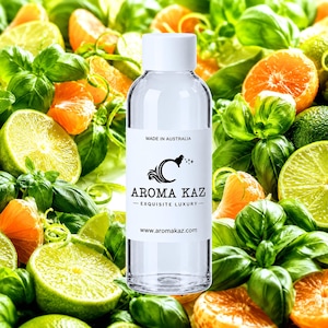 May include: A clear plastic bottle with a white cap and a white label featuring the text MADE IN AUSTRALIA, AROMA KAZ, EXQUISITE LUXURY, and www.aromakaz.com. The bottle is centred against a background of fresh green basil leaves and citrus slices.