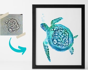 May include: Watercolor painting of a sea turtle in shades of blue and green, framed in black. The turtle is depicted swimming, with bubbles rising. A smaller image of a cell is taped to the wall, with an arrow pointing to the turtle painting.