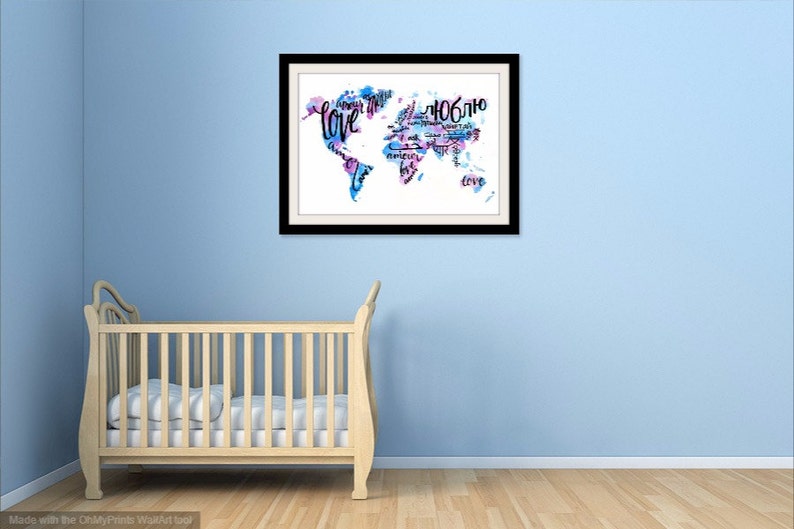 May include: A framed watercolor painting of the world map with the word "love" written in different languages. The map is painted in shades of blue and pink.