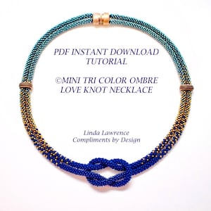 May include: A PDF tutorial for making a mini tri-color ombre love knot necklace. The necklace is made with blue, gold, and teal beads and features a love knot closure.