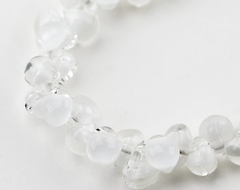UNICORN Teardrops,  White Coconut 9mm. 25 beads