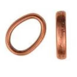 May include: A copper oval jump ring, a type of jewellery finding used for connecting chains, cords, or other jewellery components.