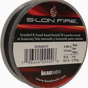 May include: A spool of black S-LON FIRE braided and fused bead thread. The label reads "braided & fused bead thread/fil à perles tressé et fusionné/hilo trenzado y fusionado para cuentas". The spool is 50 yards (45.7 meters) long and weighs 6 pounds (2.72 kilograms).
