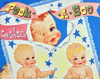 May include: A vintage paper doll set featuring four baby dolls. The dolls are dressed in white and pink nappies and have blonde hair. The cover of the set features a blue background with white stars and a pink banner that reads "Peek-A-Boo".