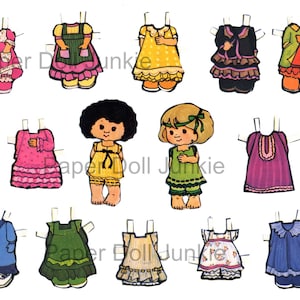 May include: A set of paper dolls with various outfits. The dolls have brown hair and are wearing different dresses, skirts, and tops. The outfits include a yellow dress with white polka dots, a green dress with white polka dots, a pink dress with white ruffles, a blue dress with white ruffles, a purple dress with white ruffles, a green dress with white ruffles, a red dress with white ruffles, a black dress with white ruffles, a yellow dress with white ruffles, and a green dress with white ruffles.