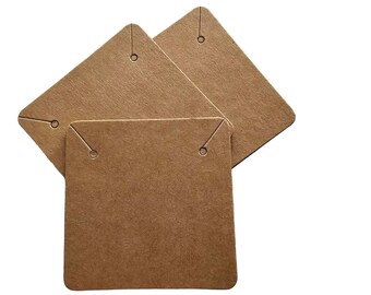 May include: Three brown cardboard necklace display cards with holes for hanging.