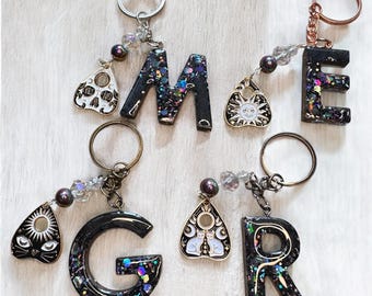 Black Sparkly Witchy Core Enchanting Initial Keychains with Planchette Charm. Four different designs. Goth girl gift, Witchy, Mystical gift