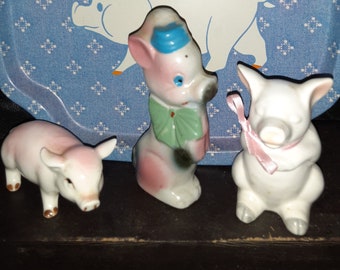 3 ceramic pigs and small pig tin platter
