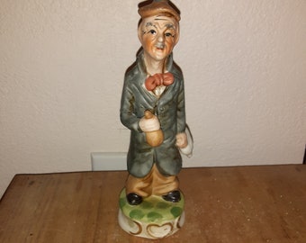 Sweet old man with a goose and a bag of money