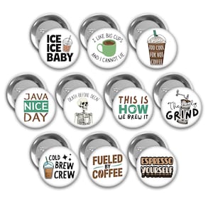 May include: A collection of round, silver-backed buttons with various coffee-themed designs. Text includes "Ice Ice Baby," "I Like Big Cups," "Too Cool for Hot Coffee," "Java Nice Day," "Death Before Decaf," and "Espresso Yourself."