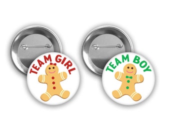 Team Girl and Team Boy Gingerbread Christmas gender reveal pins with red and green.  Perfect for winter holiday themed party.