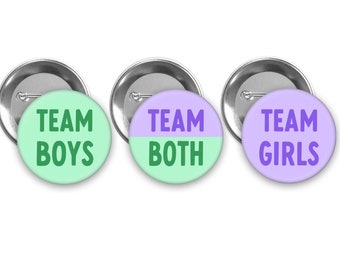 May include: Three round button badges with silver backs. The badges are divided into three teams: Team Boys, Team Girls, and Team Both. The Team Boys badge is green with white text. The Team Girls badge is purple with white text. The Team Both badge is green and purple with white text.