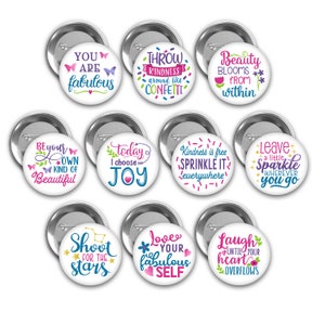 May include: Ten colorful round buttons with inspirational quotes and designs. The buttons feature butterflies, stars, hearts, and confetti. The quotes include "You are fabulous", "Throw kindness around like confetti", "Beauty blooms from within", "Be your own kind of beautiful", "Today I choose joy", "Kindness is free sprinkle it everywhere", "Leave a little sparkle wherever you go", "Shoot for the stars", "Love your fabulous self", and "Laugh until your heart overflows".