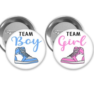 Team Boy and Team Girl Sneaker gender reveal pins.  White background with pink and blue.