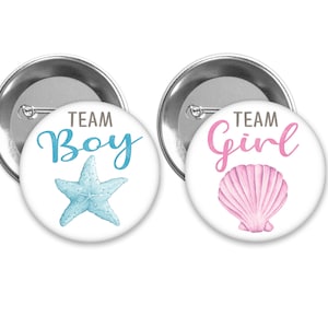 Team Girl and Team Boy Seashell and Starfish gender reveal pins with pink and blue.  Perfect for an Under the Sea themed party.