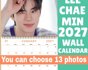 May include: A 2027 wall calendar featuring a photograph of Lee Chae Min at the top and a January grid below. The text reads LEE CHAE MIN 2027 WALL CALENDAR and You can choose 13 photos. The calendar has a spiral binding and a white background.