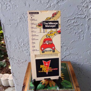 The Milage Manager, Mileage Manage Slide guide, Pontiac mileage manager, gas saving tips, travel guide, Vintage Pontiac auto advertisement