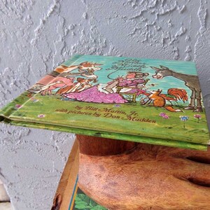May include: A vintage children's book titled "The Mother Who Didn't Know Much" by Bill Martin Jr. with pictures by Don Madden. The cover features a colorful illustration of a mother and her animal friends.