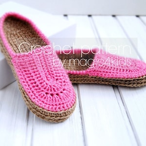 May include: A pair of pink and brown crocheted slippers. The slippers are made with a simple stitch pattern and have a brown trim around the edges. The text "Crochet pattern by magic4kids" is visible on the image.