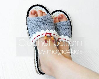 May include: A pair of gray crochet slippers with white trim and red beads. The slippers are on a white surface. Crochet pattern by magic4kids.