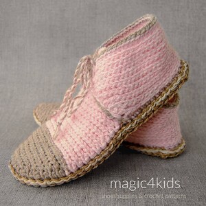 May include: A pair of pink and brown crocheted slippers with a brown crocheted trim. The slippers have a lace-up design.