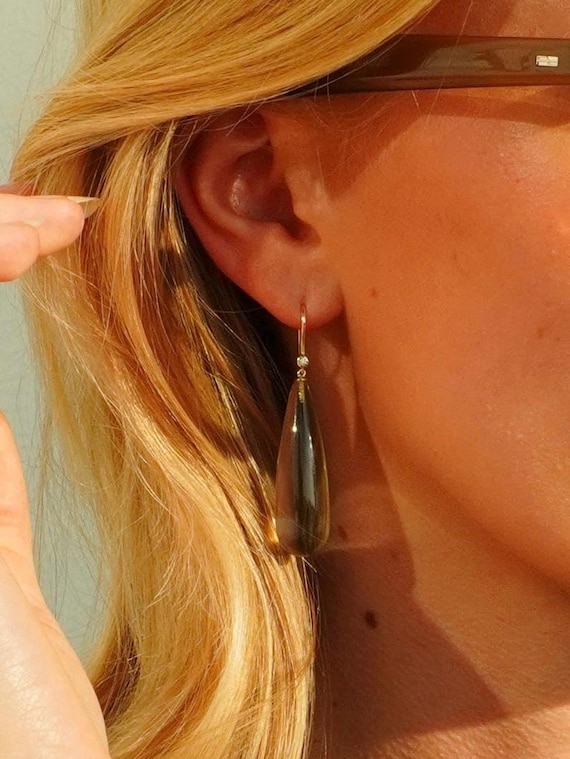 The Agnes Earrings with freshwater pearls.