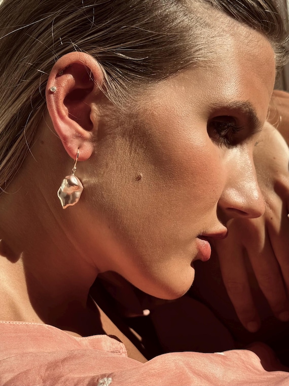 The Agnes Earrings with freshwater pearls.