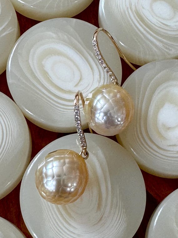 The Margot Earrings with freshwater pearls.