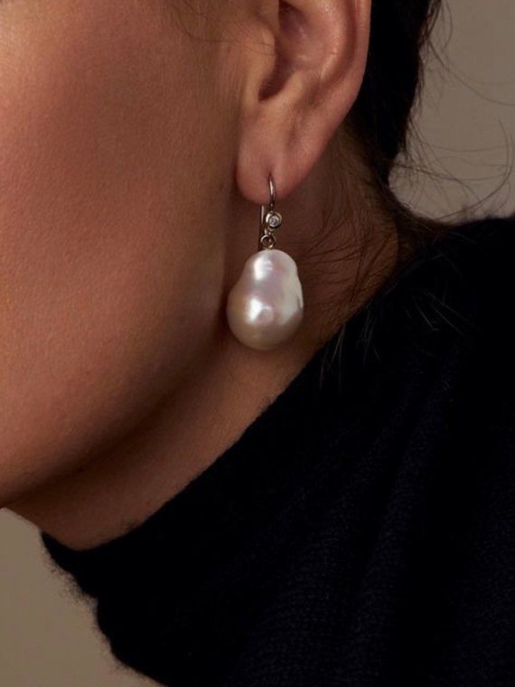 The Agnes Earrings with freshwater pearls.