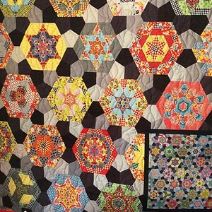 May include: A quilt pattern booklet titled "Southern Aurora" by Lilabelle Lane Creations, featuring a colorful quilt design with a variety of geometric shapes and patterns. The booklet is by Sharon Burgess.