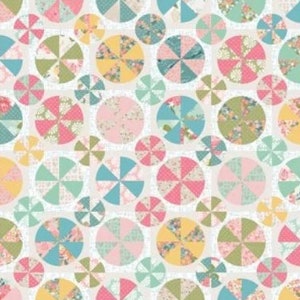 May include: A colorful fabric pattern with a repeating design of circles with a pinwheel pattern inside. The circles are in shades of pink, yellow, green, and blue. The background is white.