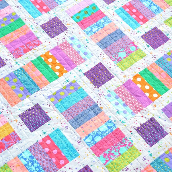 Iris Quilt kit using True Colors Fat Quarters by Tula Pink for FreeSpirit Fabrics - Pattern by Kitchen Table Quilting