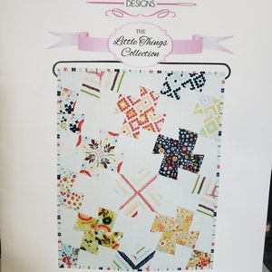 May include: A quilting pattern for a wall hanging called "Whirly Gig" from the "The Little Things Collection" by Sue Daley Designs. The pattern features a colorful patchwork design with a white background.