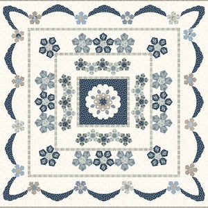 May include: A white quilt with a blue and white floral pattern. The quilt is made up of many small squares, each with a different design. The quilt is surrounded by a border of blue and white scalloped fabric.