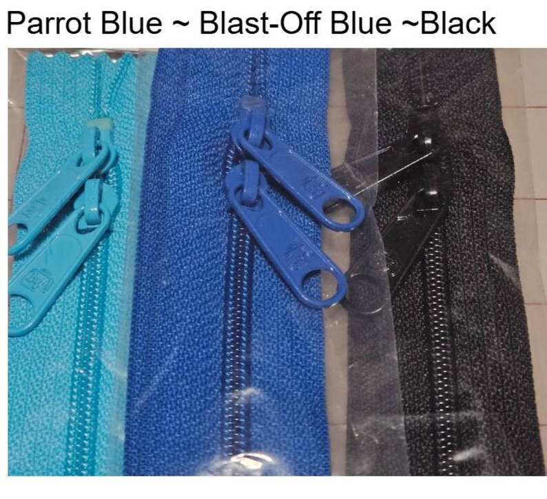 May include: Three zipper closures in different colors: parrot blue, blast-off blue, and black. The zippers are packaged in clear plastic.