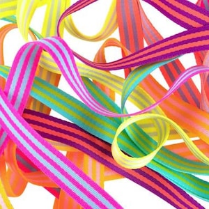 May include: A collection of colorful striped ribbons in various shades of pink, orange, yellow, green, and purple. The ribbons are woven with thin white stripes.