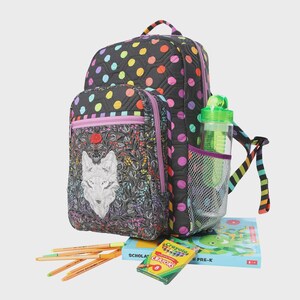 May include: Black backpack with colorful polka dots and a smaller matching lunch bag. The lunch bag features a wolf design. A water bottle, crayons, and a book are in the image. The backpack has a rainbow striped strap.