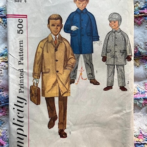May include: Vintage Simplicity pattern 3180, size 4, featuring illustrations of children's coats and suits. The pattern includes a tan trench coat, a blue coat, and a gray suit with a matching hat. The pattern is printed on aged paper.