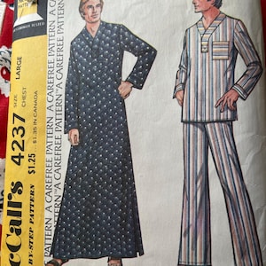 May include: A set of three ceramic mugs with a speckled, matte finish. The mugs are in shades of cream, light gray, and dark gray. Each mug has a simple, minimalist design, perfect for coffee or tea.