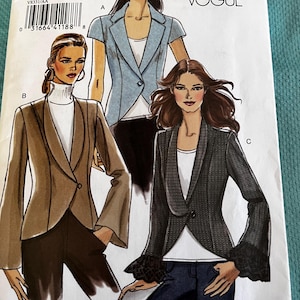 May include: A sewing pattern titled "V8331" from Very Easy Vogue, featuring illustrations of three different blazer designs. The pattern includes sizes AA (6-8-10-12). The blazers are in various colors and styles, including a short-sleeved blue blazer.