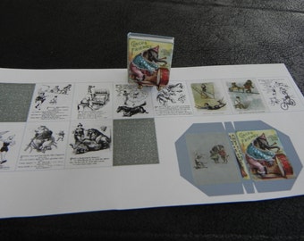 May include: A small circus-themed box with an elephant playing a drum, labelled "Circus Friends." The box sits on a sheet of paper with circus illustrations. The box is approximately 2.5 cm tall.