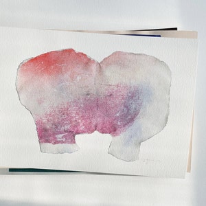 A high quality art print of a romantic abstract portrait of a kiss in off white, coral and lavender blush pink and pastel violet on white. It's composed of one piece torn paper with rough edges, accented with fine spray-painted bluish mist.