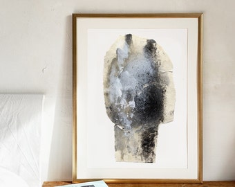 May include: A framed abstract art print with a black, gray, and white abstract design on a white background. The frame is gold.
